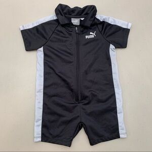 Puma One Piece 18M 1/2 zip Black Short Sleeve